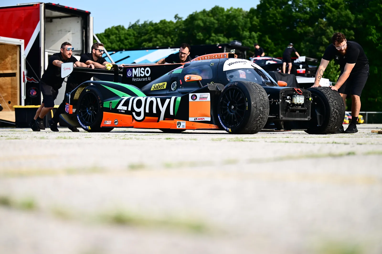 The Forbush Performance crew moving the No. 18 through the Road America paddock