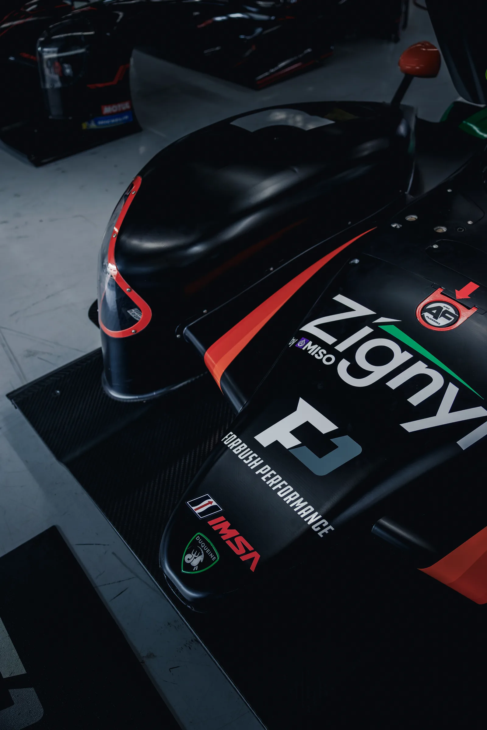 Forbush Performance branding on the race car’s carbon bodywork in the COTA garage