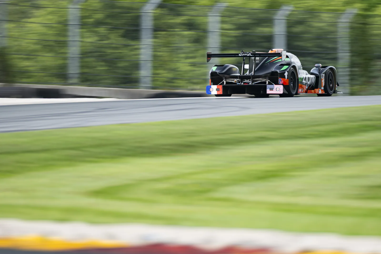 The No. 18 accelerating away through Road America