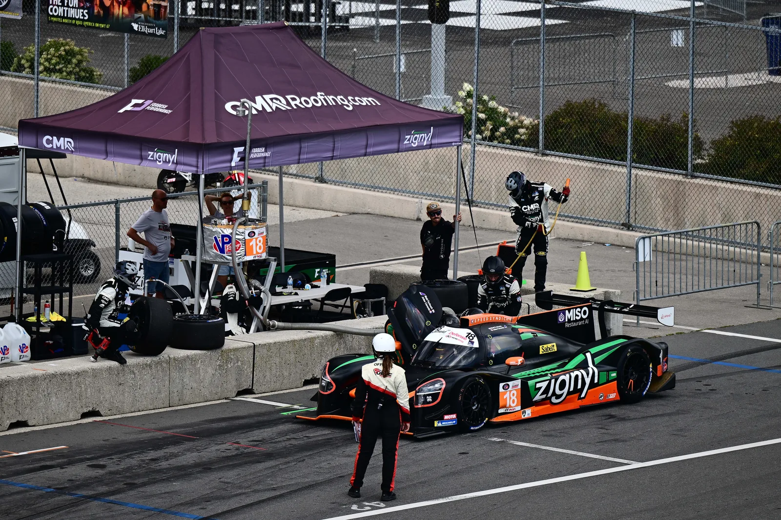 The Forbush Performance crew at work in the Road America pit lane with the No. 18