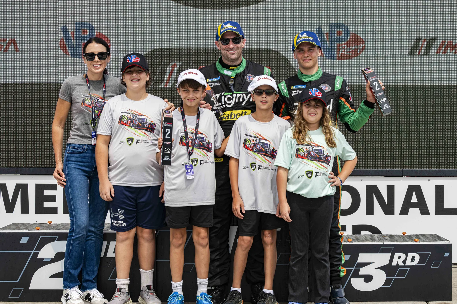 Matt Forbush, his family and Jules Caranta celebrating together at Road America