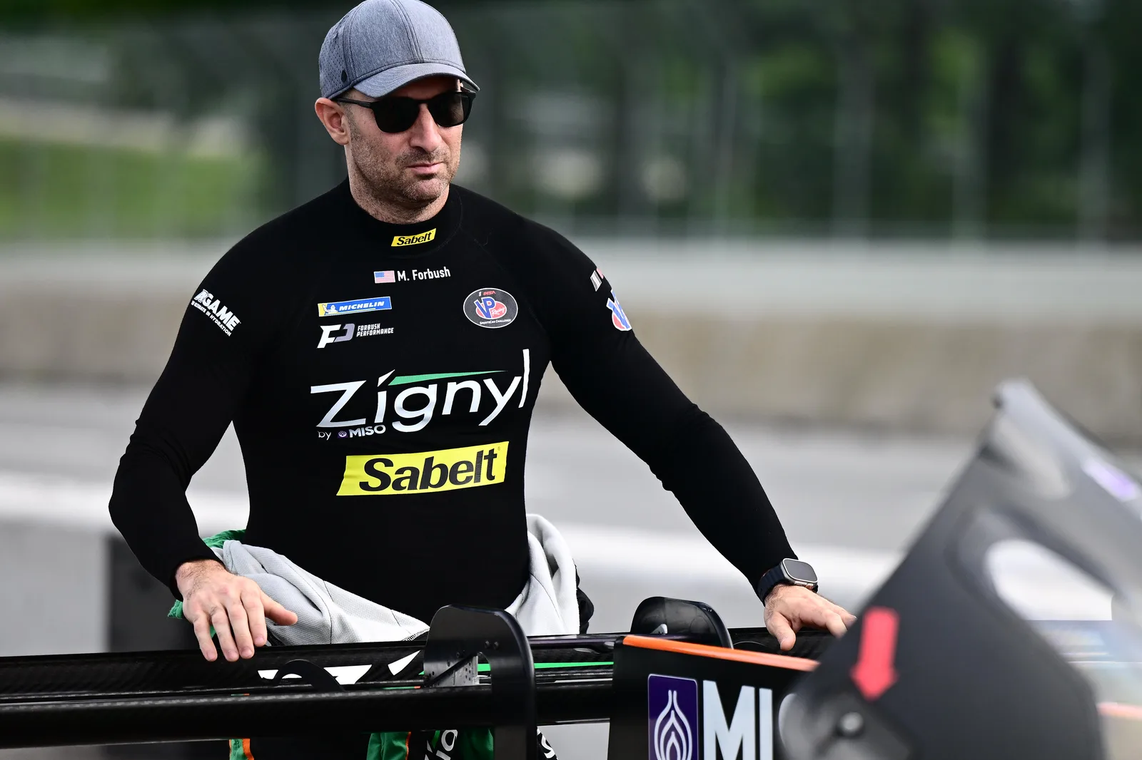 Matt Forbush beside the car before racing at Road America