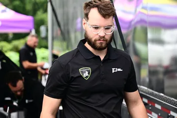A Forbush Performance crew member wearing clear glasses in the Road Atlanta paddock.