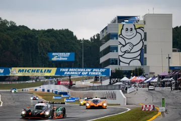 The No. 18 Duqueine leads other prototypes past the Michelin control tower at Road Atlanta.