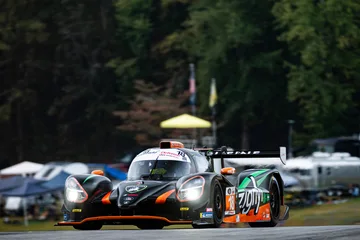 Headlights illuminated, the No. 18 Duqueine crests the track at Road Atlanta.