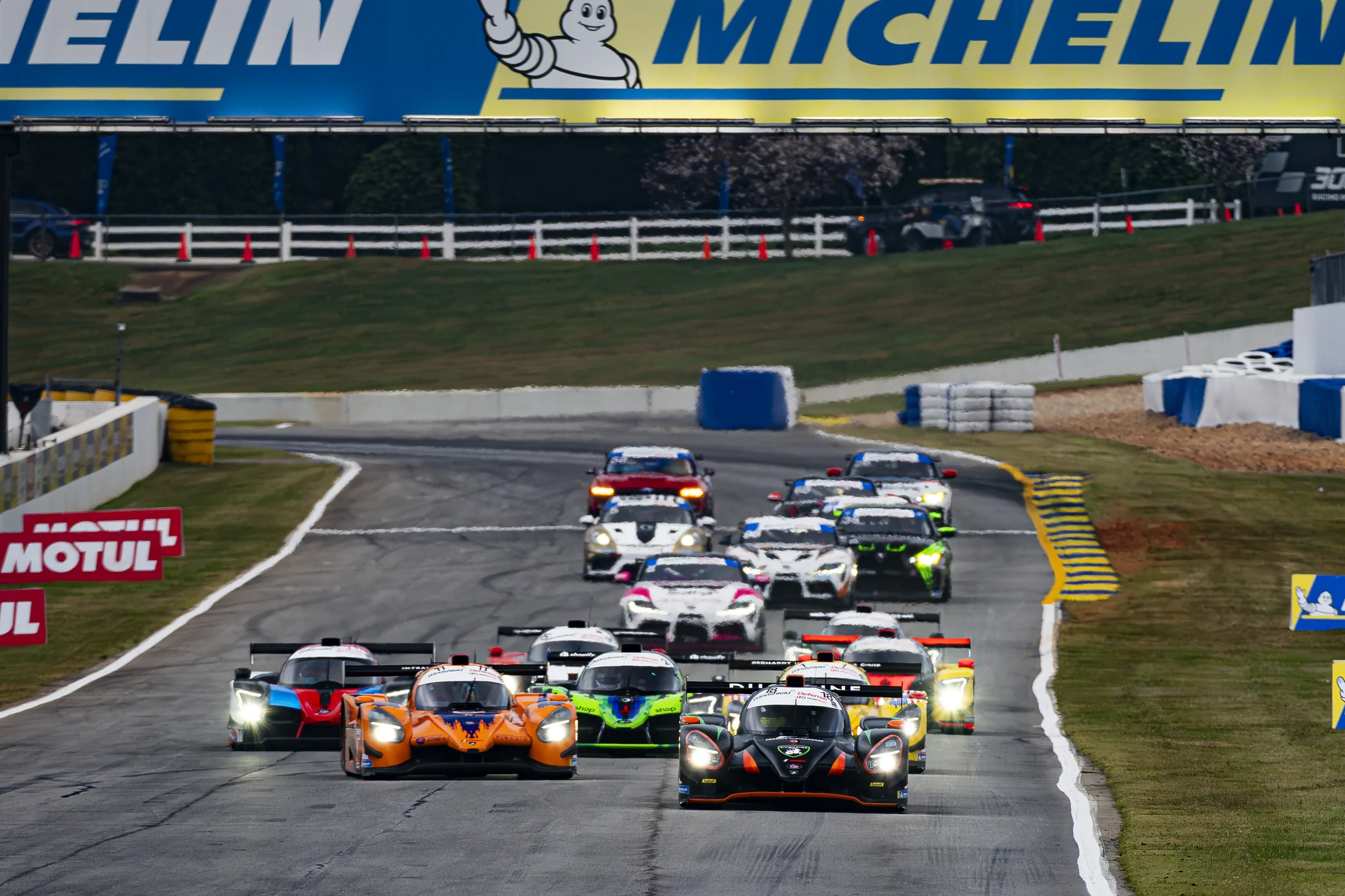 The No. 18 Forbush Performance Duqueine at the front of the field beneath the Michelin bridge at Road Atlanta
