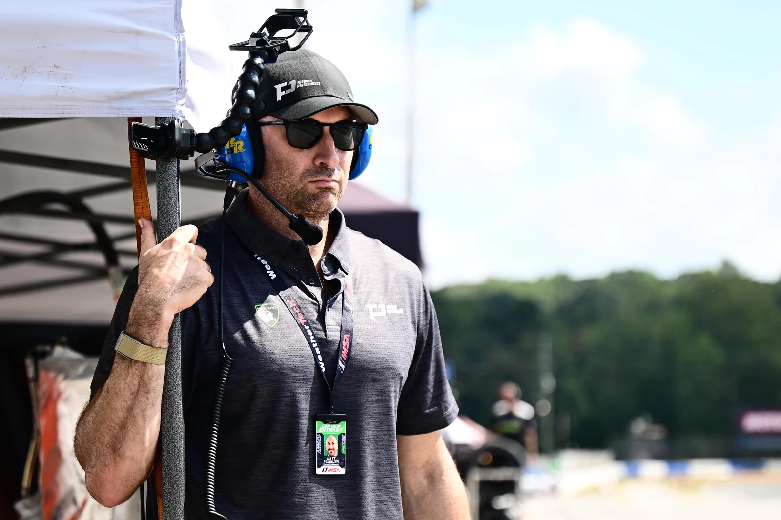 A Forbush Performance team member monitoring the race from the Road Atlanta pit wall